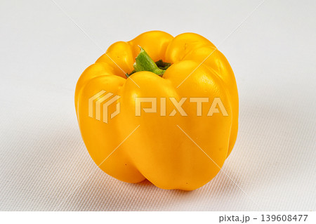 Ripe yellow sweet peppers on a dark textured background Ripe yellow sweet peppers on a dark textured background 139608477