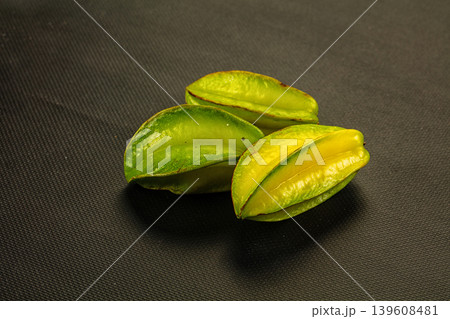 Fresh starfruit or carambola on a textured background. Fresh starfruit or carambola on a textured background. 139608481