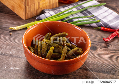 Rustic still life with a bowl of pickled gherkins, green onions, and chili peppers on a wooden table Rustic still life with a bowl of pickled gherkins, green onions, and chili peppers on a wooden table 139608517