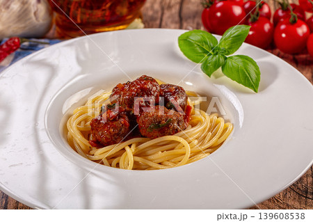 Delicious spaghetti meatballs fresh basil cherry tomatoes rustic wooden background Delicious spaghetti meatballs fresh basil cherry tomatoes rustic wooden background 139608538