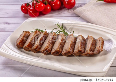 Sliced Roasted Duck Breast, Rosemary, Cherry Tomatoes, Garlic 139608543