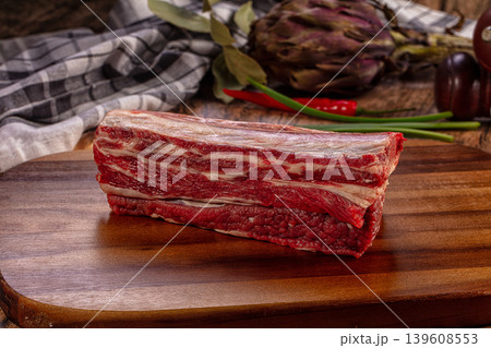 Raw Beef Short Ribs Fresh Rustic Wooden Cutting Board Garlic Chili Artichoke Raw Beef Short Ribs Fresh Rustic Wooden Cutting Board Garlic Chili Artichoke 139608553