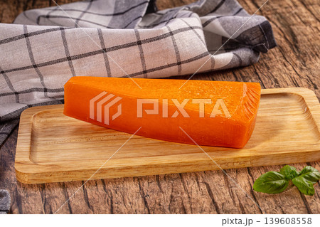 Orange Cheese Wedge, Wooden Board, Plaid Cloth 139608558