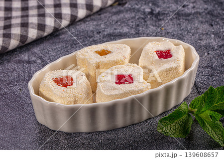 Coconut coated Turkish delight with fruit jelly in white bowl Coconut coated Turkish delight with fruit jelly in white bowl 139608657