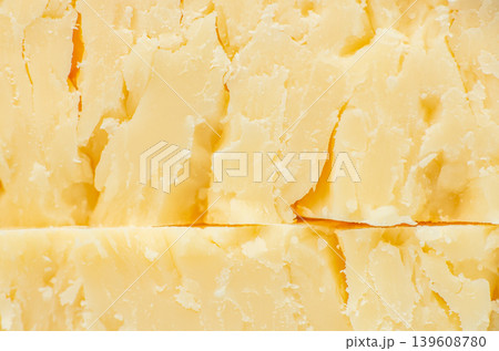 Aged parmesan cheese texture background close up Aged parmesan cheese texture background close up 139608780