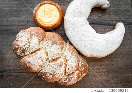 Fresh pastries buns wicker basket rustic style bakery 139609213