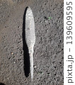 Ancient and rusty Javanese spearhead showing pitted metal texture on the ground in Indonesia. 139609595