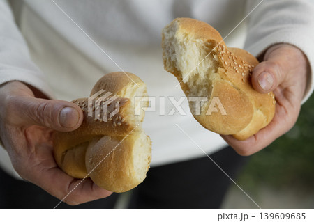 Hands Holding Freshly Baked Bread Hands Holding Freshly Baked Bread 139609685