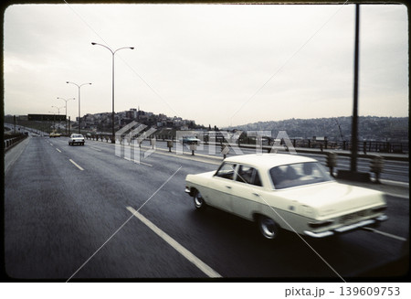 Vintage Cars Driving on Urban Highway Scene 139609753
