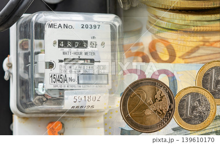 Electricity meter with gold coins energy cost. 139610170