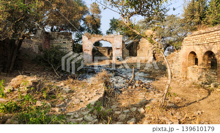 Tilla jogian pakistan ruined arch gateway and multi arch wall with ash ground Tilla jogian pakistan ruined arch gateway and multi arch wall with ash ground 139610179