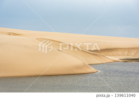 Dunes and lagoons of Atins, Lencois Maranhenses, Barreirinhas, Brazil. White sand dunes with pools of fresh water Dunes and lagoons of Atins, Lencois Maranhenses, Barreirinhas, Brazil. White sand dunes with pools of fresh water 139611040