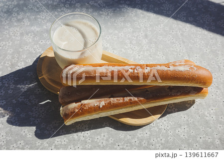 Fartons With Horchata On Wooden Tray In Sunlight Fartons With Horchata On Wooden Tray In Sunlight 139611667