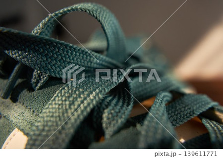 Decorative lace intertwining design. Complex textile arrangement featuring looping textures and overlapping bands design Decorative lace intertwining design. Complex textile arrangement featuring looping textures and overlapping bands design 139611771