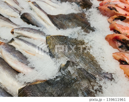 Fresh fish on ice at a seafood market in the morning Fresh fish on ice at a seafood market in the morning 139611961