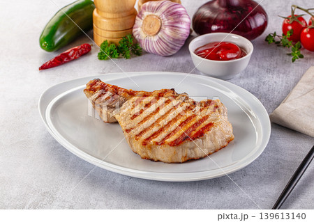 Tasty hot grilled bone steak served sauce Tasty hot grilled bone steak served sauce 139613140