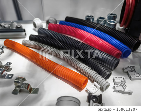 Colorful plastic tubes and fittings arranged on a table at a trade show in the afternoon 139613207