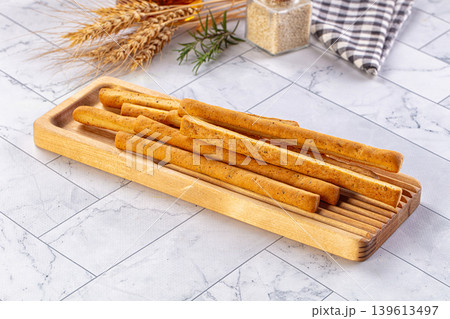 Baked Italian Grissini sticks heap Baked Italian Grissini sticks heap 139613497