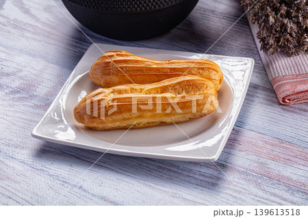 Sweet baked eclair dessert with cream Sweet baked eclair dessert with cream 139613518