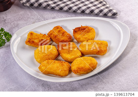 Crispy Golden Fried Food Nuggets on White Plate with Parsley Crispy Golden Fried Food Nuggets on White Plate with Parsley 139613704
