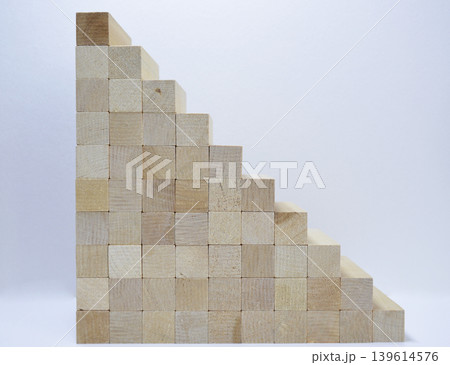 A staircase made of wooden blocks on a white background 139614576