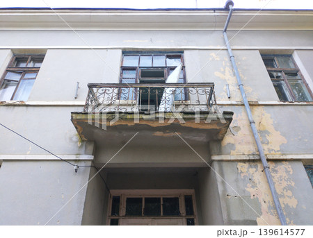The second-floor balcony is in disrepair 139614577