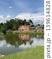 Landscape. Castle palace in lake water reflection. Castle reflection in lake water. Panorama. 139614828