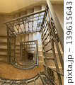 Top view of a spiral staircase with metal railing inside. 139615643