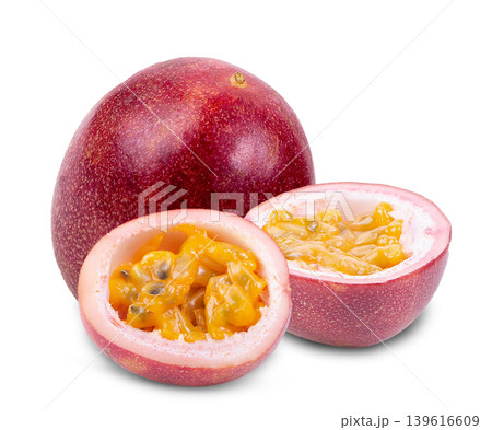 Fresh tropical passion fruit opened to reveal delicious golden pulp on white background. Fresh tropical passion fruit opened to reveal delicious golden pulp on white background. 139616609