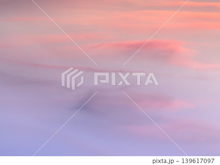 A soft canvas of twilight unfolds, showcasing a serene expanse of wispy clouds bathed in gentle pastel hues. Delicate ribbons of apricot and blush pink seamlessly dissolve into a soothing, A soft canvas of twilight unfolds, showcasing a serene expanse of wispy clouds bathed in gentle pastel hues. Delicate ribbons of apricot and blush pink seamlessly dissolve into a soothing, 139617097