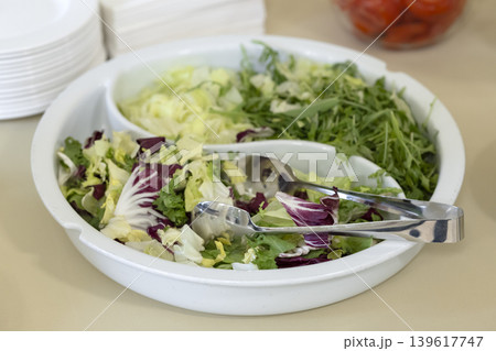 Fresh green salad mix on a buffet table Fresh green salad mix on a buffet table 139617747