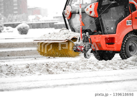 Rotary brush of a sidewalk snow removal machine . Rotary brush of a sidewalk snow removal machine . 139618698