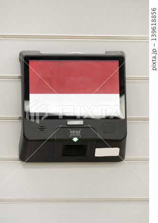 Electronic self-service terminal with a touchscreen   mounted on an indoor wall.Concept of digital technology, automation, and user interaction. 139618856