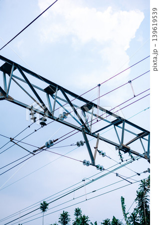 Railway power poles for electric commuter train transportation Railway power poles for electric commuter train transportation 139619539