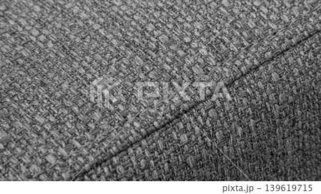 Textured Gray textile background with diagonal stitching Textured Gray textile background with diagonal stitching 139619715