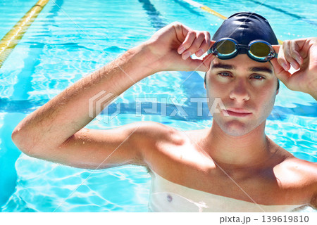 Swimming pool, serious and portrait of sports man ready for exercise, outdoor workout or practice. Aqua, water and face of competitive swimmer determined for waterpolo, fitness or summer cardio Swimming pool, serious and portrait of sports man ready for exercise, outdoor workout or practice. Aqua, water and face of competitive swimmer determined for waterpolo, fitness or summer cardio 139619810