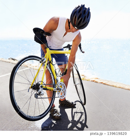 Man, bicycle and wheel service on road for safe cycling transport, performance or puncture. Male person, tyre and gear improvement for speed or endurance or triathlon training, sport or practice 139619820
