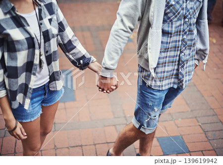 Love, walking and couple holding hands on relax journey, morning trip or weekend tour for outdoor adventure. Fashion, casual clothes and romantic people commute on street, road or sidewalk floor Love, walking and couple holding hands on relax journey, morning trip or weekend tour for outdoor adventure. Fashion, casual clothes and romantic people commute on street, road or sidewalk floor 139619942