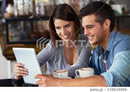 Tablet, coffee shop and couple of people reading online restaurant report, service insight or research of hospitality industry. Remote work, cafeteria teamwork or partner cooperation on project study Tablet, coffee shop and couple of people reading online restaurant report, service insight or research of hospitality industry. Remote work, cafeteria teamwork or partner cooperation on project study 139619989