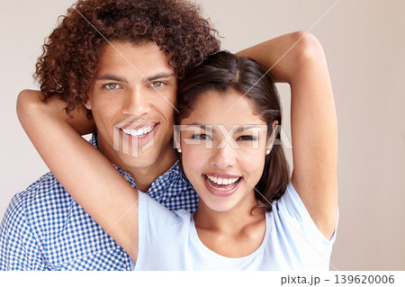 Couple, romance and hugging in studio portrait, love and bonding in relationship on brown background. Happy people, loyalty and support in embrace, security and trust in marriage commitment or care 139620006