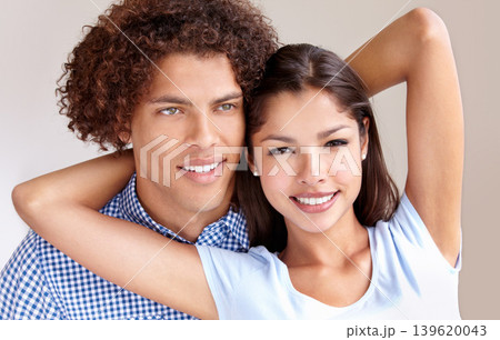 Couple, partnership and embrace in studio, love and bonding in relationship on brown background. Happy people, loyalty and support in unity, security and trust in marriage commitment or care in hug 139620043