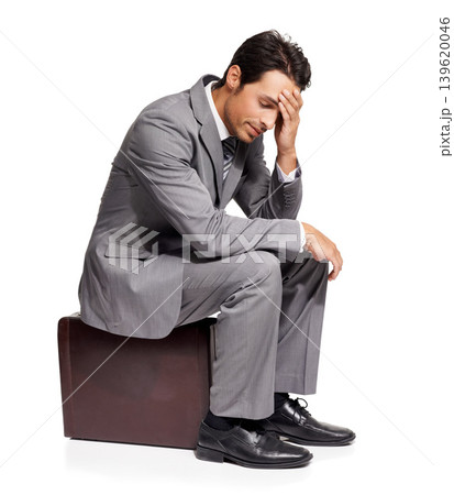 Thinking, stress and business man with briefcase in studio for travel, fail or mistake on white background. Doubt, anxiety and person sitting on a bag with headache, disaster or compliance problem Thinking, stress and business man with briefcase in studio for travel, fail or mistake on white background. Doubt, anxiety and person sitting on a bag with headache, disaster or compliance problem 139620046