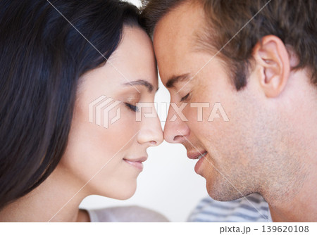 Couple, forehead touch and bonding together for love, loyalty and commitment or security in marriage. People, romance and affection in apartment, support and connection in relationship or closeup 139620108