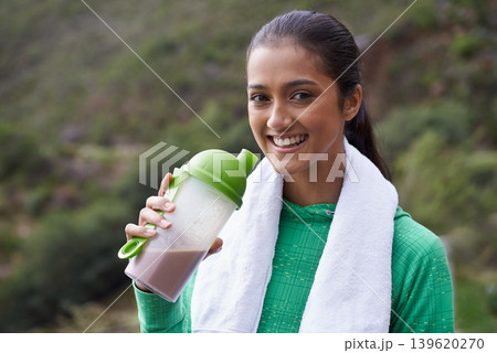 Sports, drink and portrait of woman with protein shake in bottle for health, wellness and energy benefits for exercise. Outdoor, hiking or person with smoothie for nutrition in diet after workout 139620270