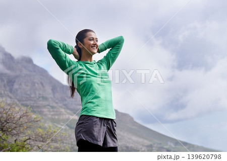 Happy, hiking and woman with achievement on mountain with pride, freedom and celebration in nature on blue sky. Outdoor, fitness and person with success in environment winner and relax on hill Happy, hiking and woman with achievement on mountain with pride, freedom and celebration in nature on blue sky. Outdoor, fitness and person with success in environment winner and relax on hill 139620798
