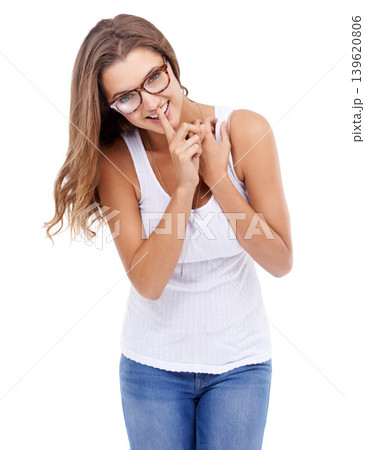 Happy woman, portrait or secret with finger on lips in studio for privacy, confidential surprise or announcement on white background. Model, glasses or quiet emoji for gossip, mystery news or whisper Happy woman, portrait or secret with finger on lips in studio for privacy, confidential surprise or announcement on white background. Model, glasses or quiet emoji for gossip, mystery news or whisper 139620806