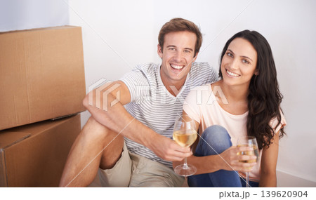 Couple, portrait and wine in new house and celebration with happiness and real estate. Property, glasses with alcohol drink and people moving with boxes excited for future investment and mortgage Couple, portrait and wine in new house and celebration with happiness and real estate. Property, glasses with alcohol drink and people moving with boxes excited for future investment and mortgage 139620904