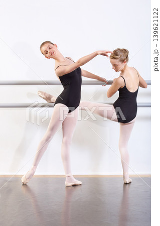Dancing, girls and teenager in practice for ballet with fitness, happy or artistic performance routine. Dance studio, friends or creative class in preparation for entertainment, training or rehearsal Dancing, girls and teenager in practice for ballet with fitness, happy or artistic performance routine. Dance studio, friends or creative class in preparation for entertainment, training or rehearsal 139621122