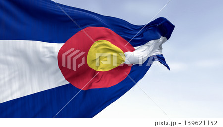 Close-up of Colorado state flag waving in the wind on a clear day Close-up of Colorado state flag waving in the wind on a clear day 139621152