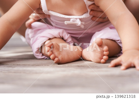 Youth, baby feet and family hands with love, bonding and child care with parenting and outdoor. Together, support and kid with newborn, holding and barefoot with trust, toddler and relax with parent 139621318